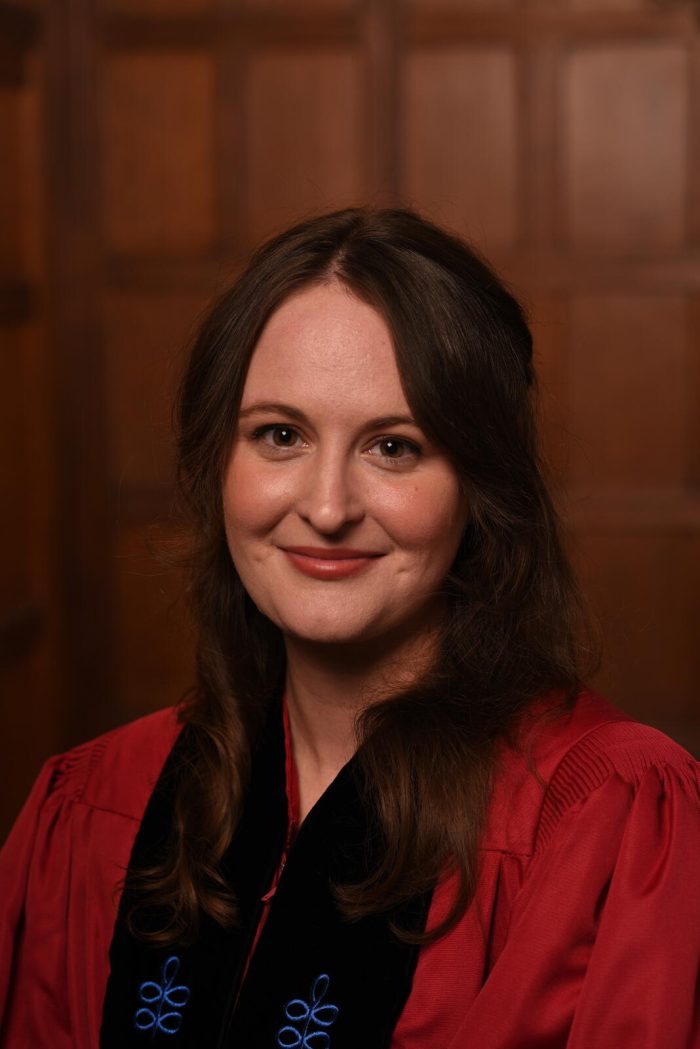 Portrait photograph of Dr Alana Mailes in academic dress