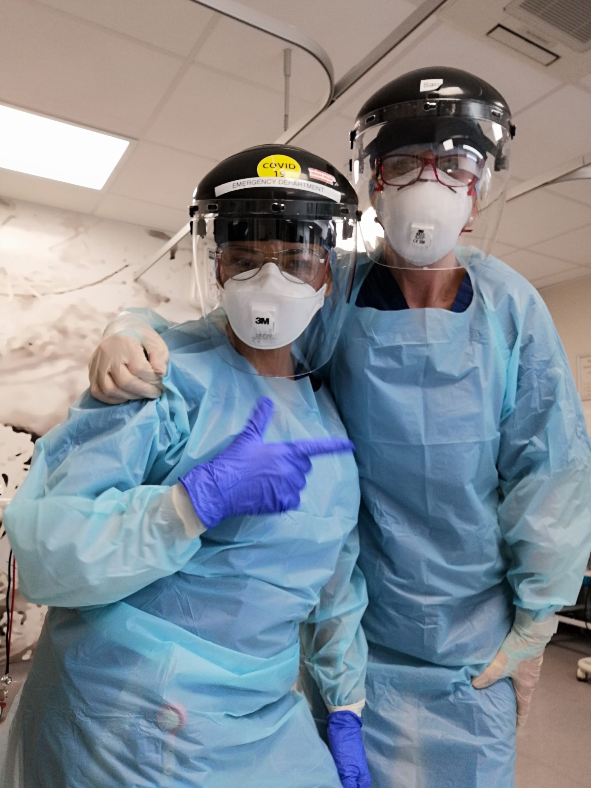 Jo Rhodes, Trinity Hall nurse, and an A&E colleague in full PPE