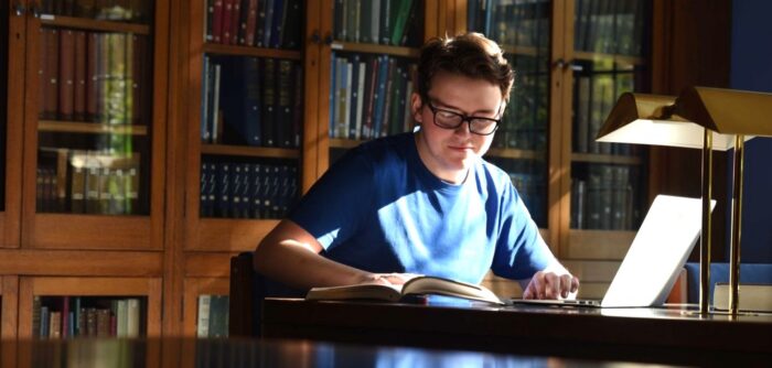 student reading in library
