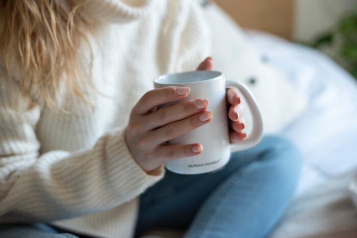 person holding a mug