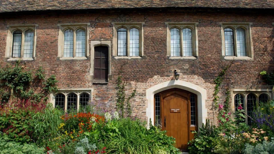 View of the Graham Storey Room and Old Library from the outside, with flower border.