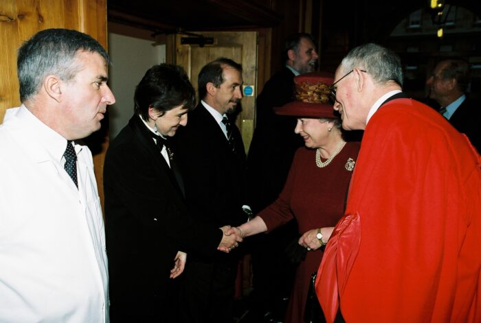 Sara Rhodes welcoming Queen Elizabeth the second on the occasion of the formal opening of the Graham Storey Room in 2000.