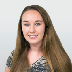 Colour photograph of a woman smiling at the camera.