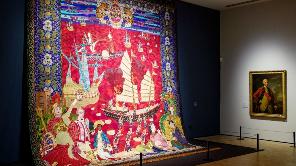 Caption for image of tapestry: Installation view of Adeela Suleman's tapestry, Imperium Amidst Opium Blossoms: A Kashidakari on the era of the East India Company, 2023-2025, with Nathaniel Dance-Holland's portrait of Robert Clive (Clive of India) from "Tigers & Dragons: India and Wales in Britain", from 23 May to 2 November 2025, at Glynn Vivian Art Gallery, Swansea. Photographer: Polly Thomas.   