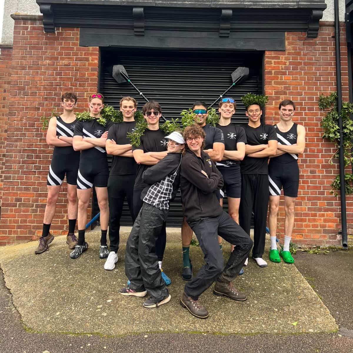 Men's Second boat posing at the Boathouse after a successful bump on the final day of Lent Bumps 2026.
