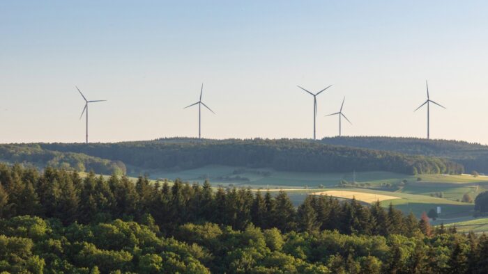 Wind turbines in the rolling countryside hills.