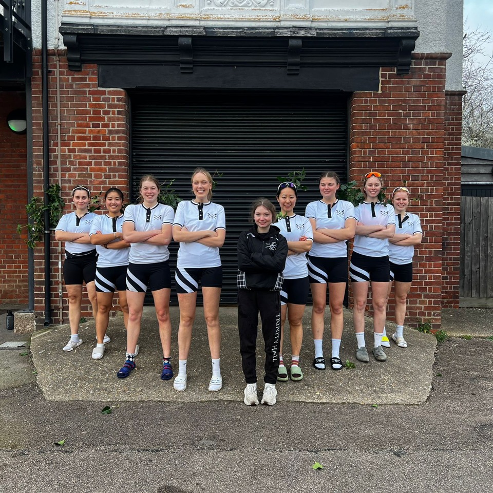 Women's First boat group photo at the THBC Boathouse after bumping on day 2 of Lent Bumps 2026.