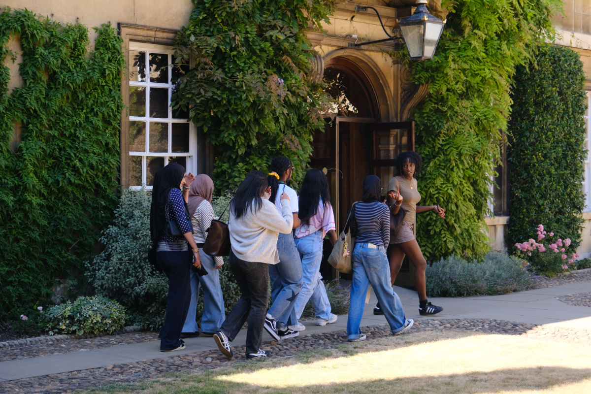A student ambassador shows a group of You'll Fit In students around the college.