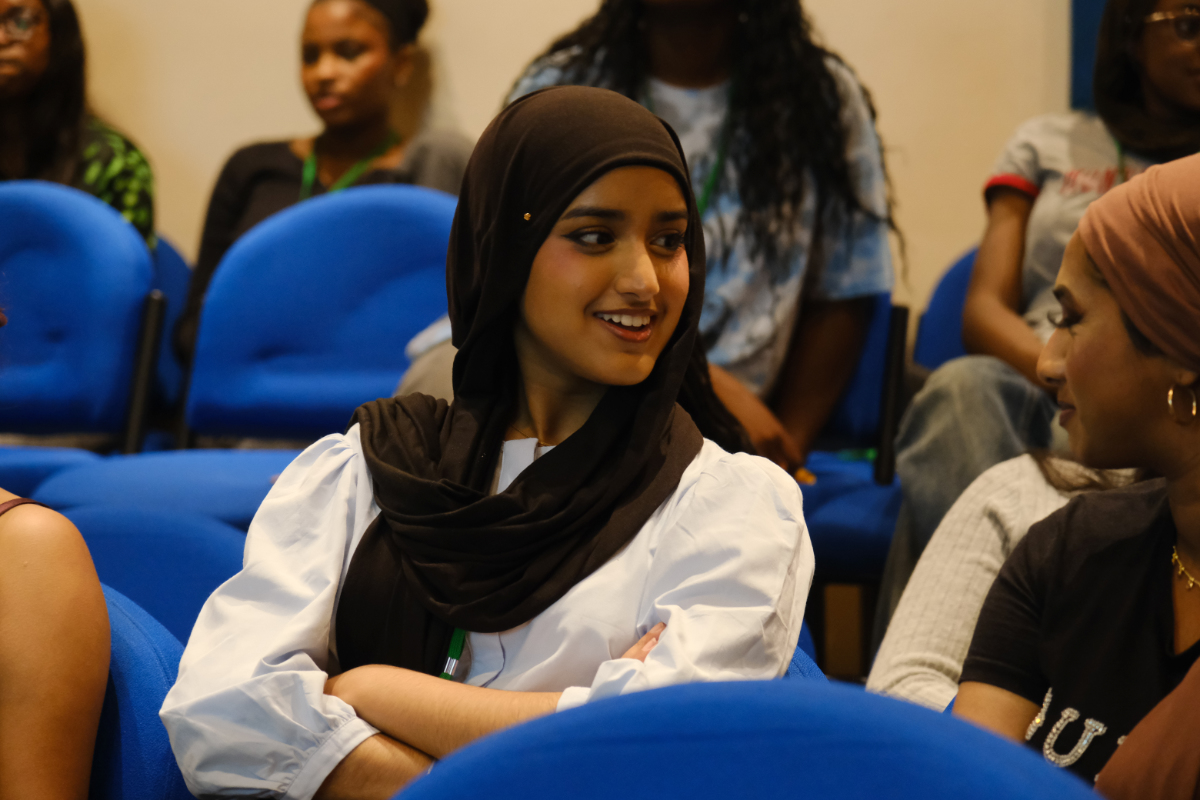 You'll Fit In students chatting during an information session.