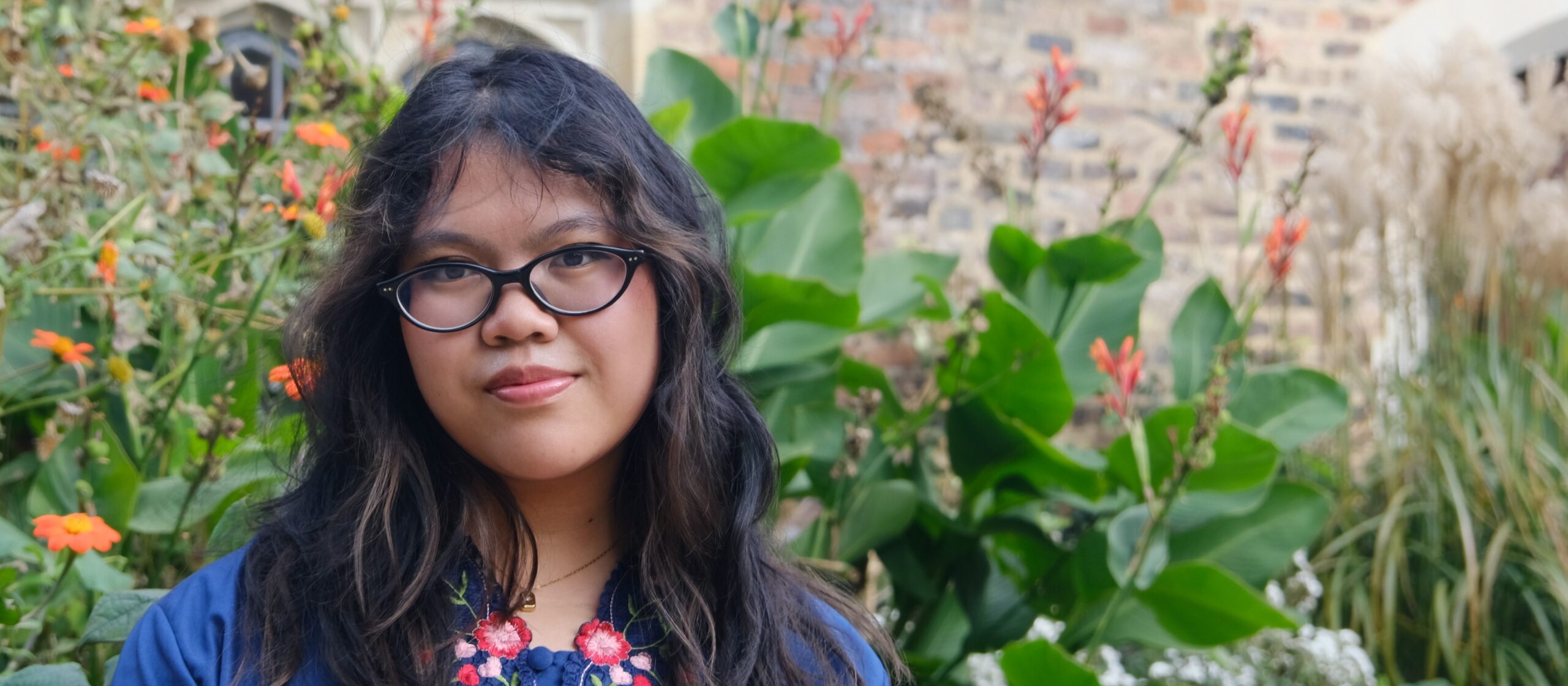 Student Amalina Saifulmazli standing outside Trinity Hall